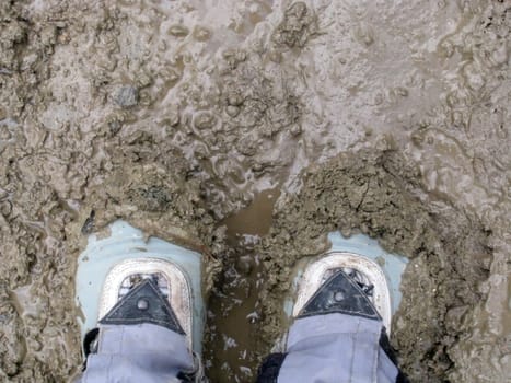 Boots; footwear; a dirt; a swill; feet; road