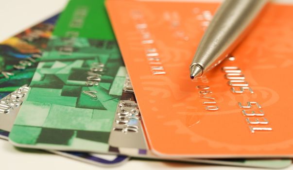 Pen on credit cards. Shallow depth of field. Financial background