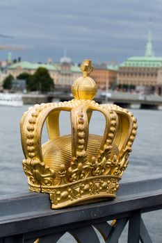 The golden crown on the bridge in Stockholm