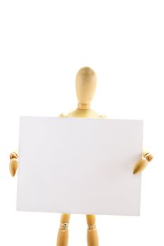 Wooden mannequin holding blank note on white background