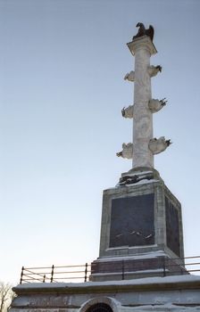 Classical column on blue sky background