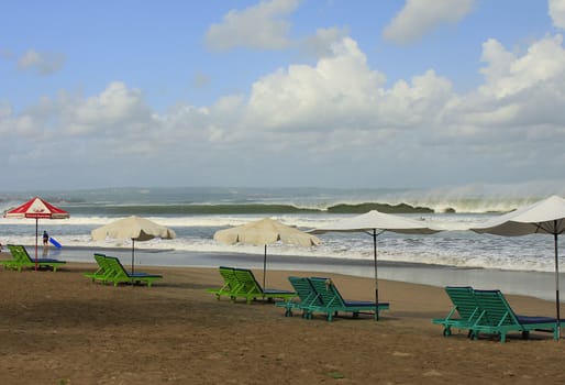 row of chairs at the beach