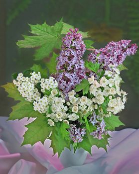 lilac and tiny white flowers in vase 