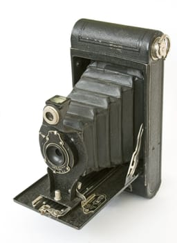 vintage folding camera isolated in white