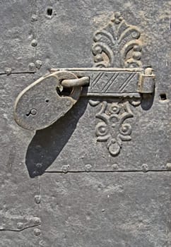 Old metal door with padlock
