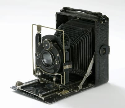 vintage folding camera isolated in white