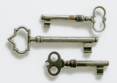 three vintage keys  isolated at white
