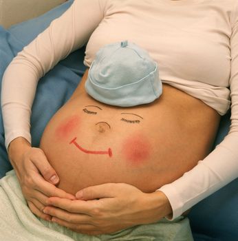 Pregnant belly with picture of funny face