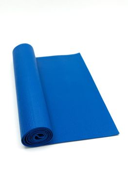 An exercise mat isolated against a white background