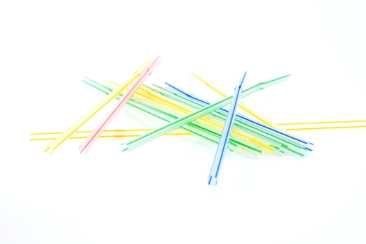 Plastic straws for cocktail on white background