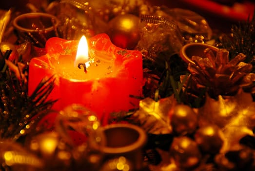 red new year burning candle in gold decoration background