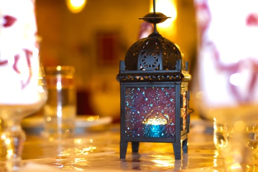 Oriental lamp on table at wedding
