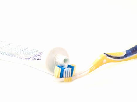 Modern tooth brush and tooth paste isolated on white