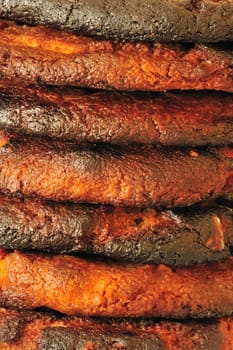 Macro image of a pile of burned biscuits.