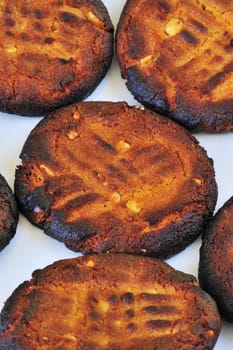 A pattern of burned biscuits on a plate.