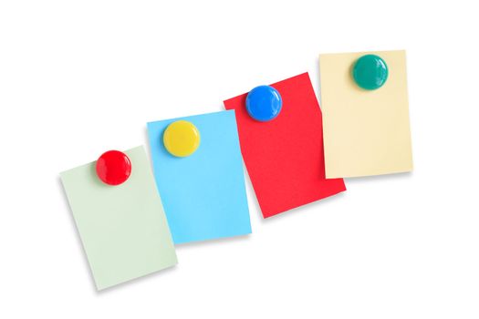 Few colored paper sheets hanging with magnets on white background. Clipping path included