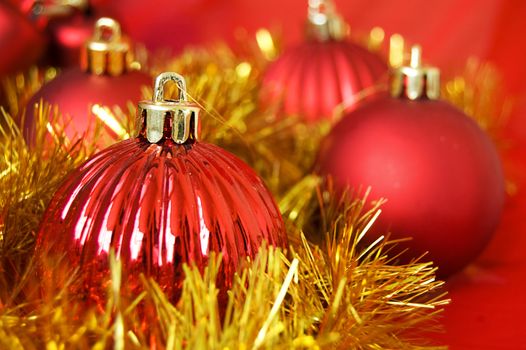 Red balls with golden decoration as Christmas background