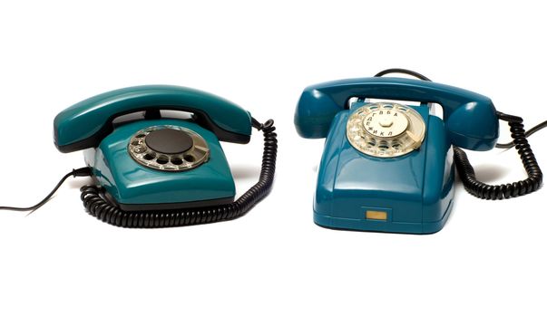 Two old dial phone on a white background.