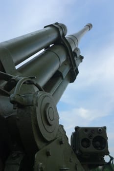 Old Antiaircraft gun on a background of blue sky