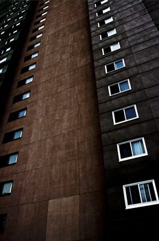 A low key perspective shot of an apartment building.
