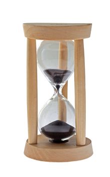 Closeup of an hourglass with black sand, isolated over white