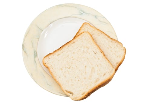 two pieces of bread at plate against white