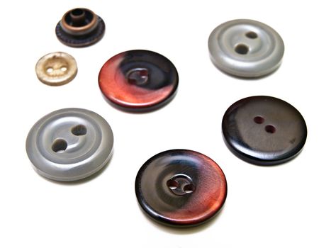different multicolored buttons over the white backgrpund