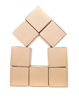 Cardboard boxes formed as a house isolated on white background