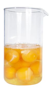 Yolks of eggs are in glass