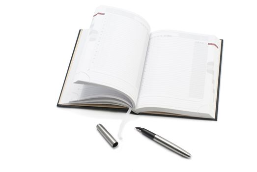 Pen and notebook on white background