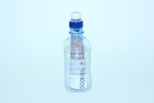 Bottle with money inside.Conceptual image