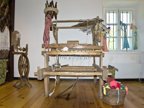 old wooden loom in the center of the room