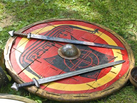 two swords on the red painted shield