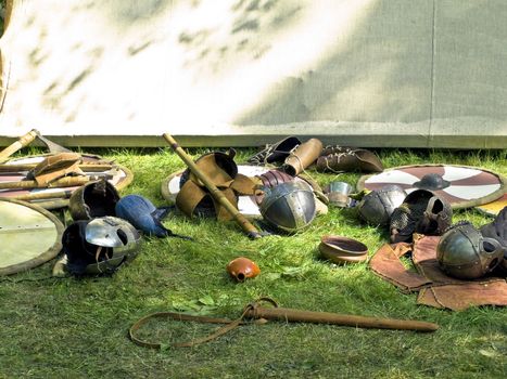 scattered metallic armor at the green grass