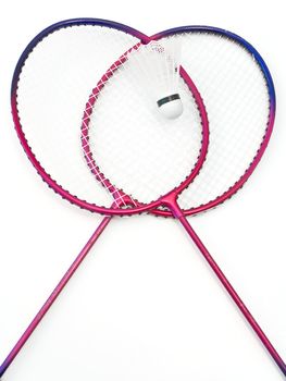 badminton rackets and shuttlecock at the white table 