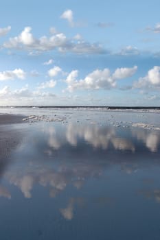 the waves with reflection crashing in on ballybunion beach ireland
