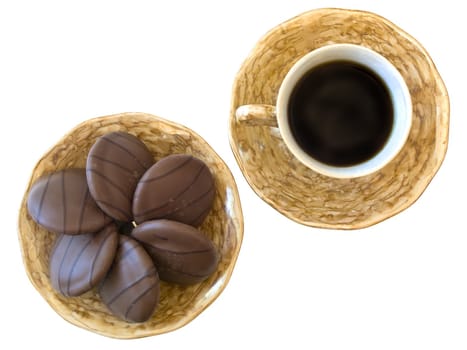 isolated cup of coffee and plate with biscuit against the white background