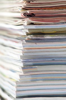 stack of colorful magazines or documents - paper edges background