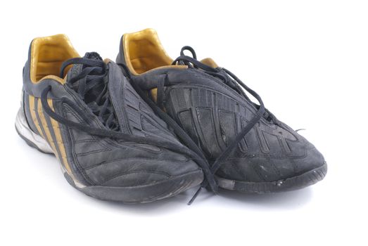  two old black soccer shoes