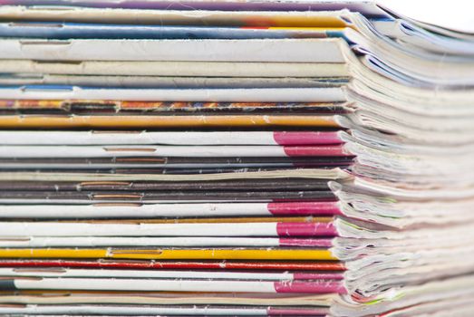 stack of colorful magazines or documents - paper edges background