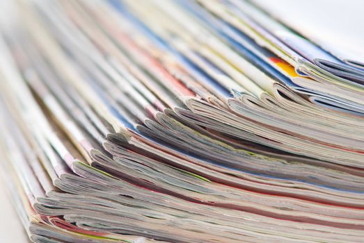 stack of colorful magazines or documents - paper edges background