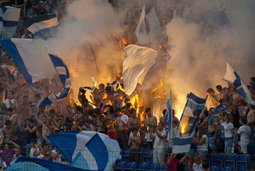 supporters burn flares