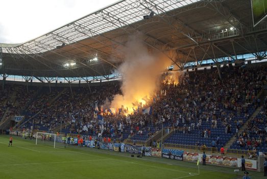 supporters burn flares