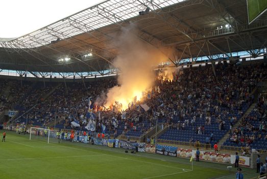 supporters burn flares