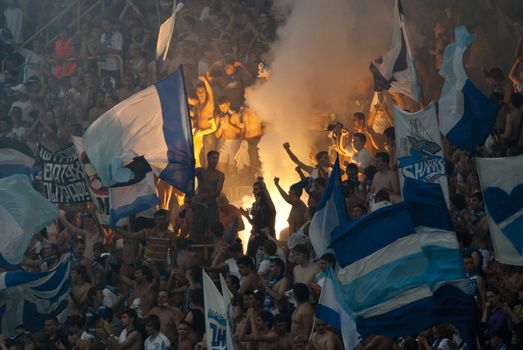 supporters burn flares