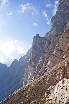 two men stand on the top of large rock