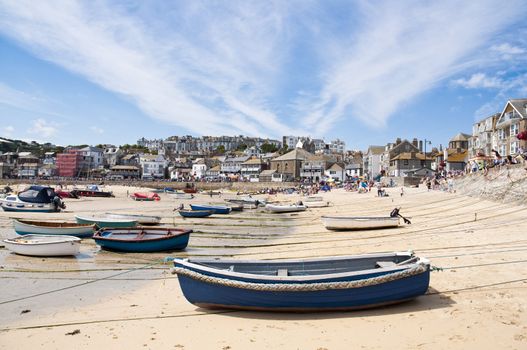 SAINT IVES, CORNWALL - AUGUST 8: Tourists and locals enjoy the beach during a low tide in St. Ives, in Cornwall, Southern UK August 8, 2010 in Saint Ives, Cornwall, UK.