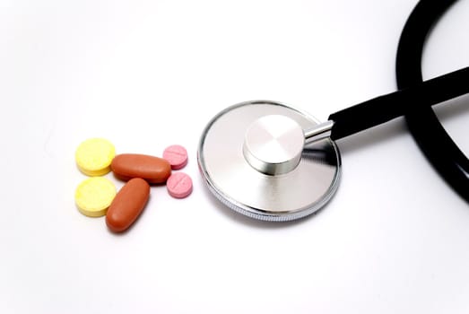 stethoscope and pills