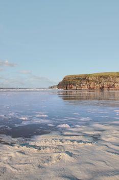 the storm waves crashing in on ballybunion beach ireland