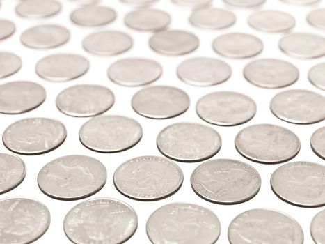 Arranged Quarter coins on white background